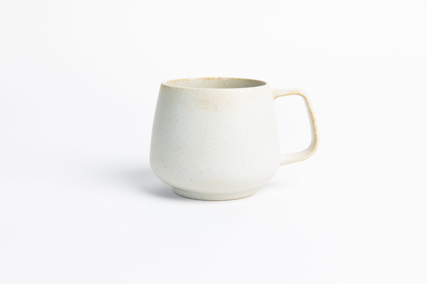 White ceramic mug on a white background