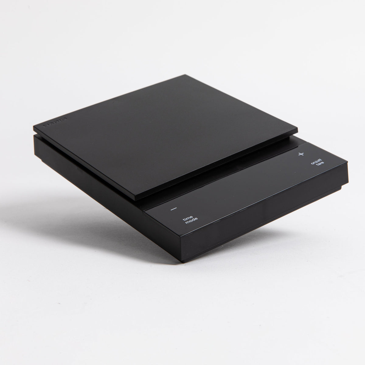 Sleek black digital square scale with a flat surface and clear LED display. set on a white background.