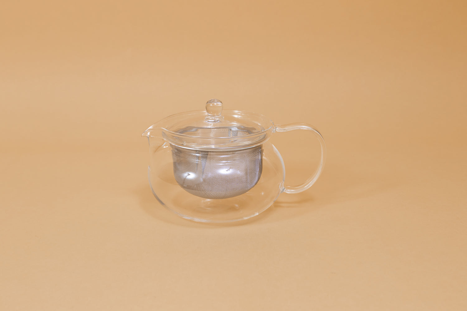 All glass round tea pot with flared top, all glass lid and handle, Metal mesh filter basket insert.