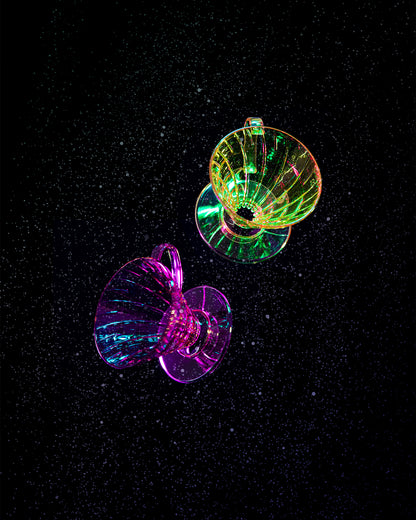 Set on a starry black background is a illuminated image of the drippers :Mauve Pink (Stardust)  and Chartreuse (Aurora)