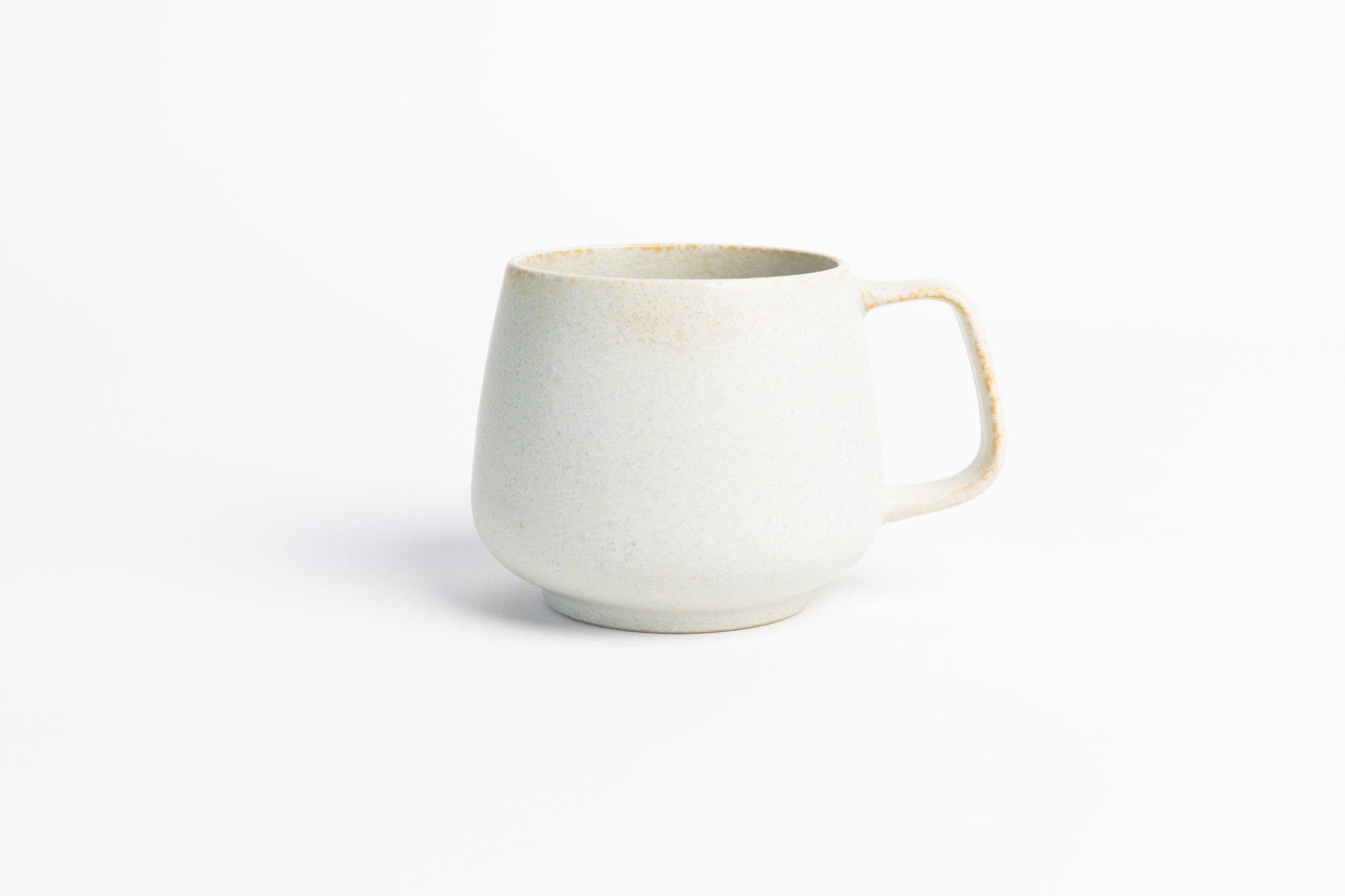 White ceramic mug on a white background