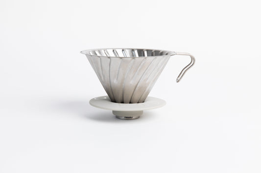 Silver metal coffee cone dripper with handle on a white background