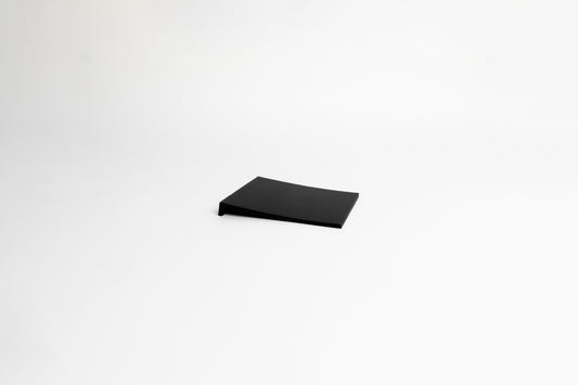 Black square silicone mat on a white background