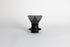 Translucent black plastic cone shaped dripper with bezier ridges in a black silicone base with clear plastic push switch