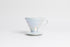 Iridescent cone shaped ceramic coffee dripper with handle and round base. Set on white background