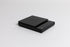 Sleek black digital square scale with a flat surface and clear LED display. set on a white background.