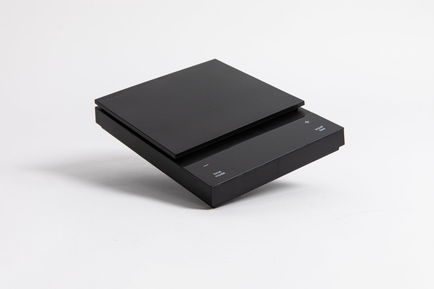 Sleek black digital square scale with a flat surface and clear LED display. set on a white background.