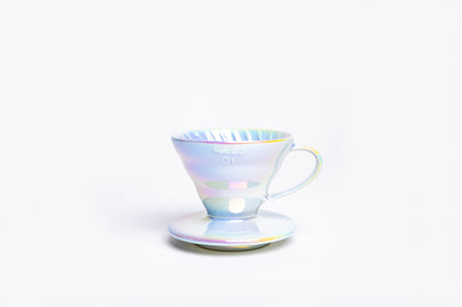 Iridescent cone coffee dripper with handle on a white background