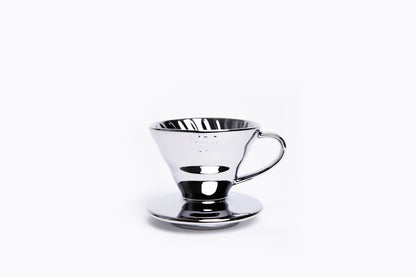 Silver metallic cone coffee dripper with handle on a white background