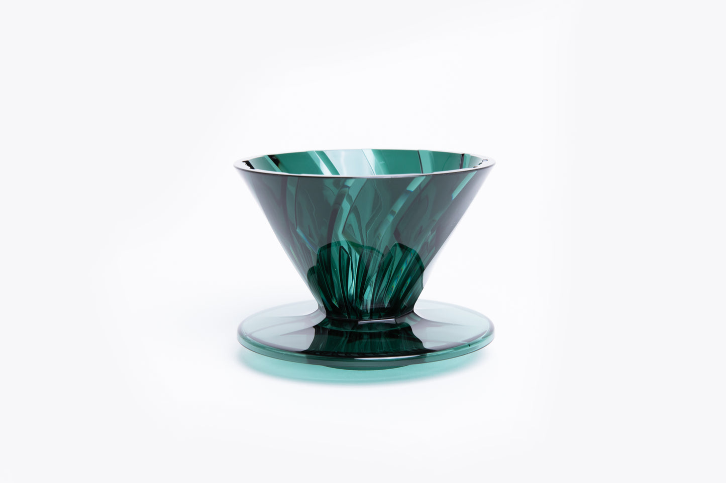 transparent green plastic cone dripper on white background.