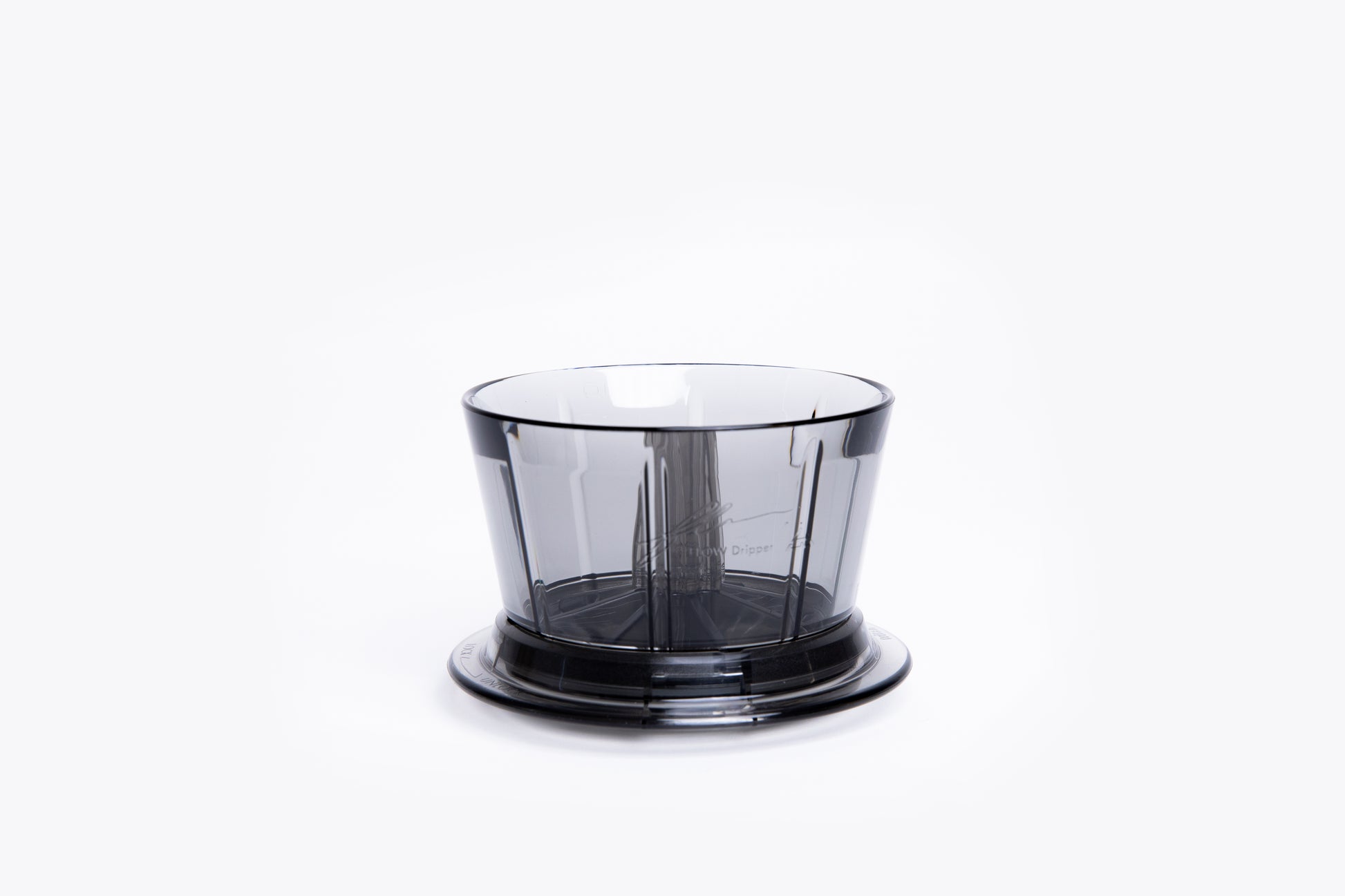 Transparent gray plastic coffee dripper with a flat base on white background