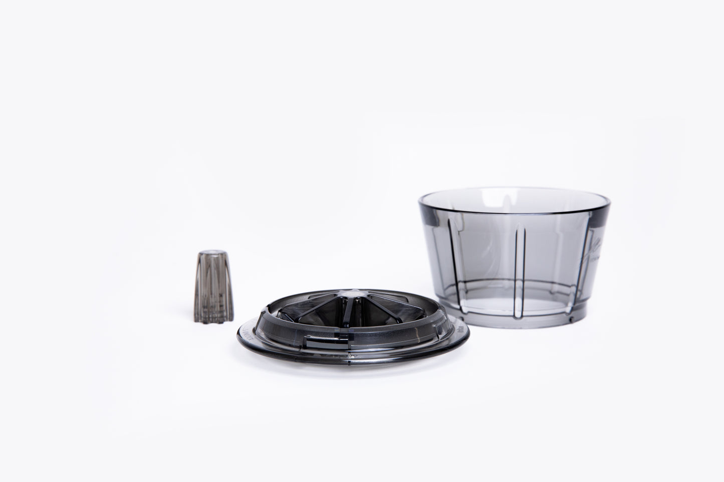 Transparent gray plastic coffee dripper with a wide base and integrated ridges,  removable base and center insert on white background.