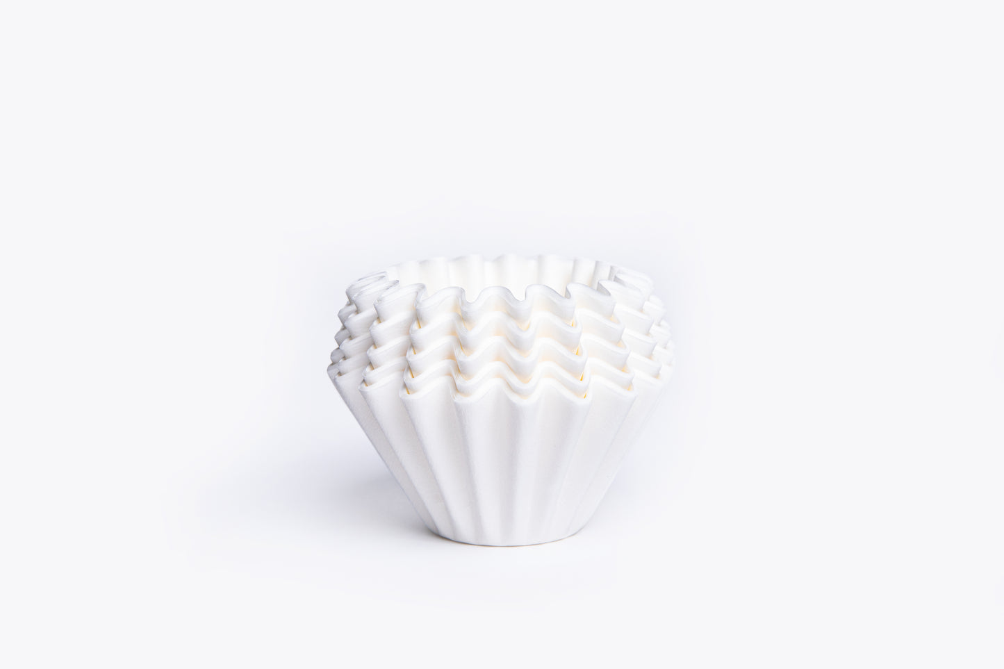 White ruffled filter liner on a white background