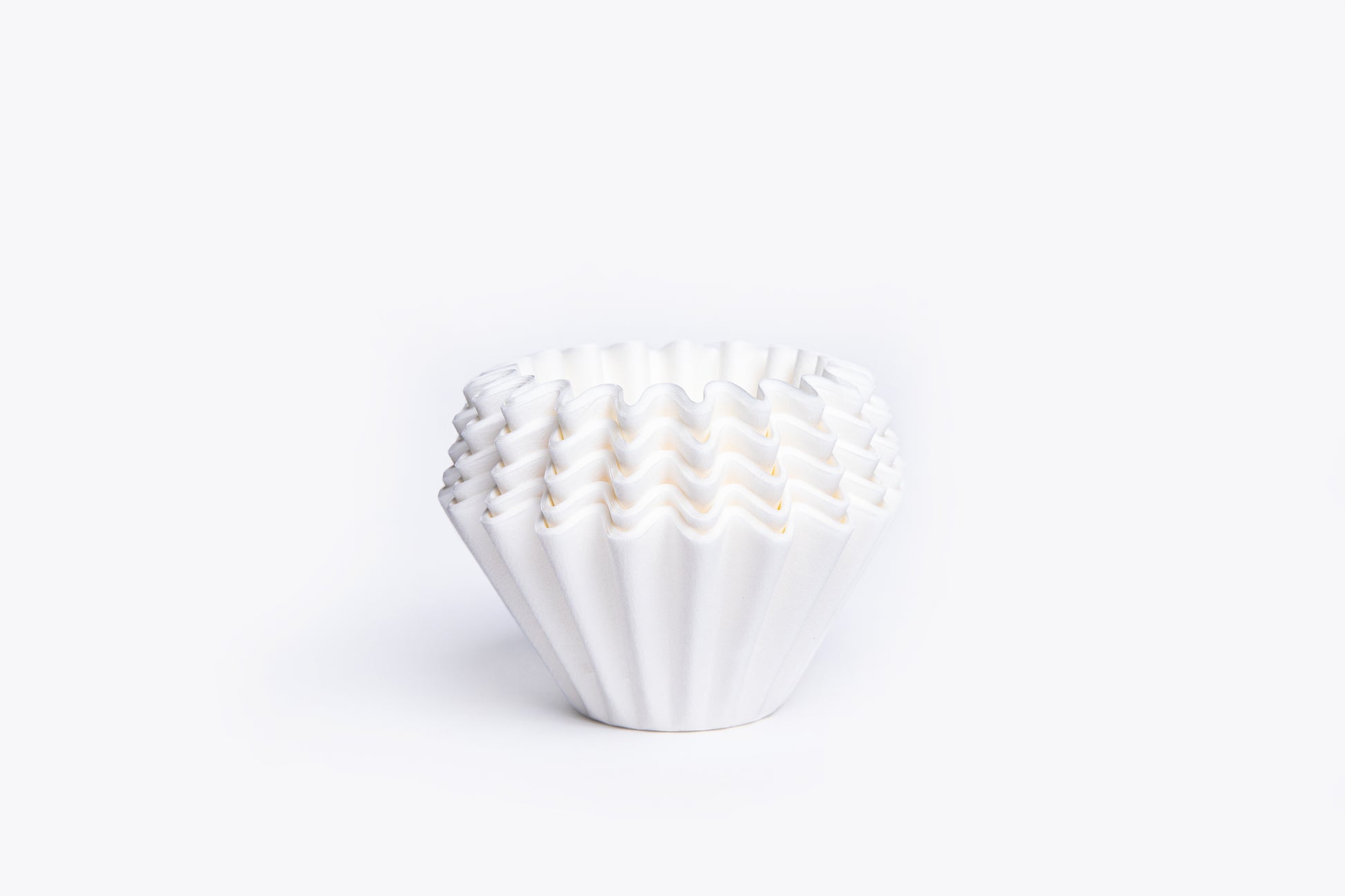 White ruffled filter liner on a white background