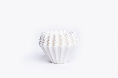 White ruffled filter liner on a white background