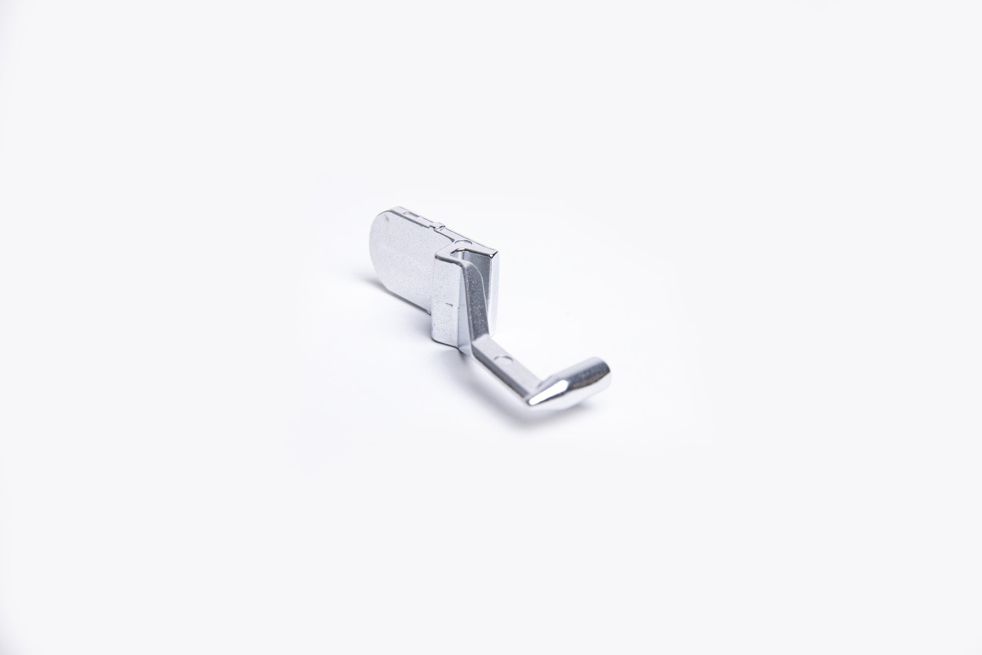  silver metal clip on a white background