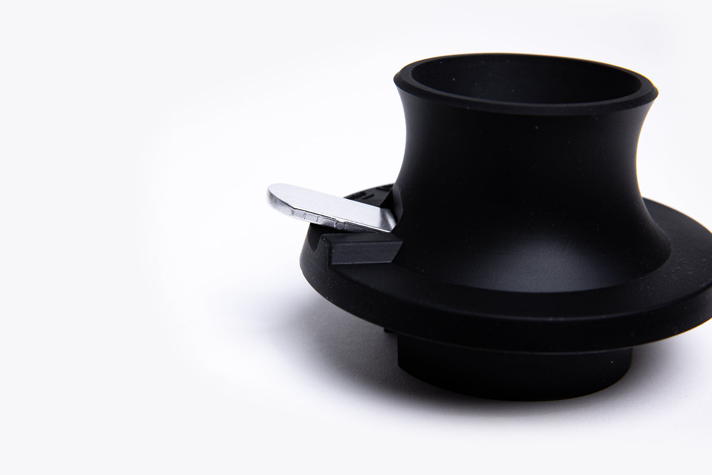 Black base with a silver trigger button on a white background.