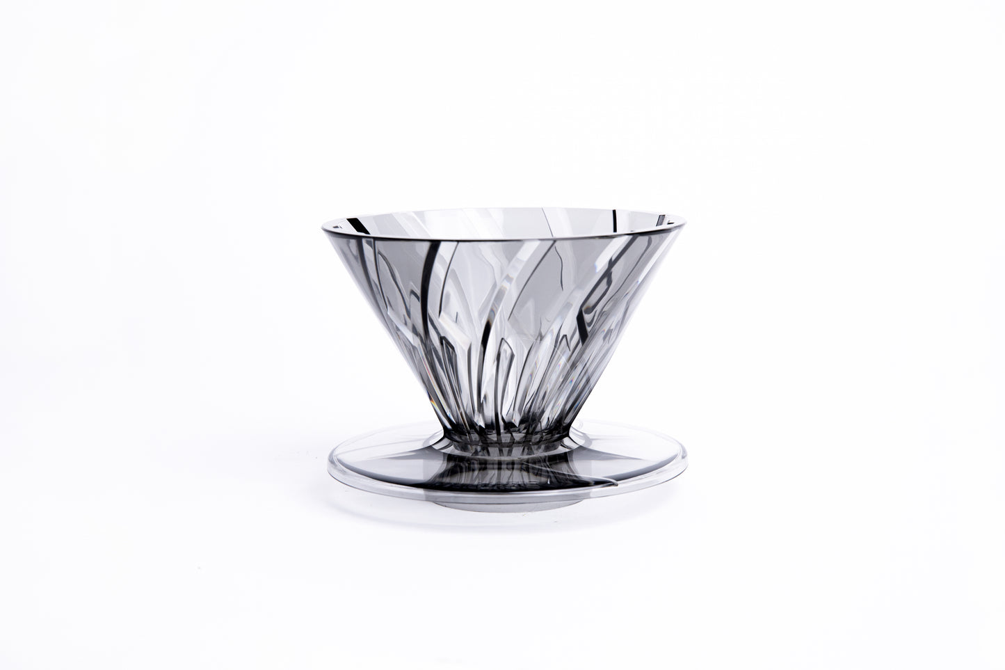 clear gray plastic cone dripper on white background.