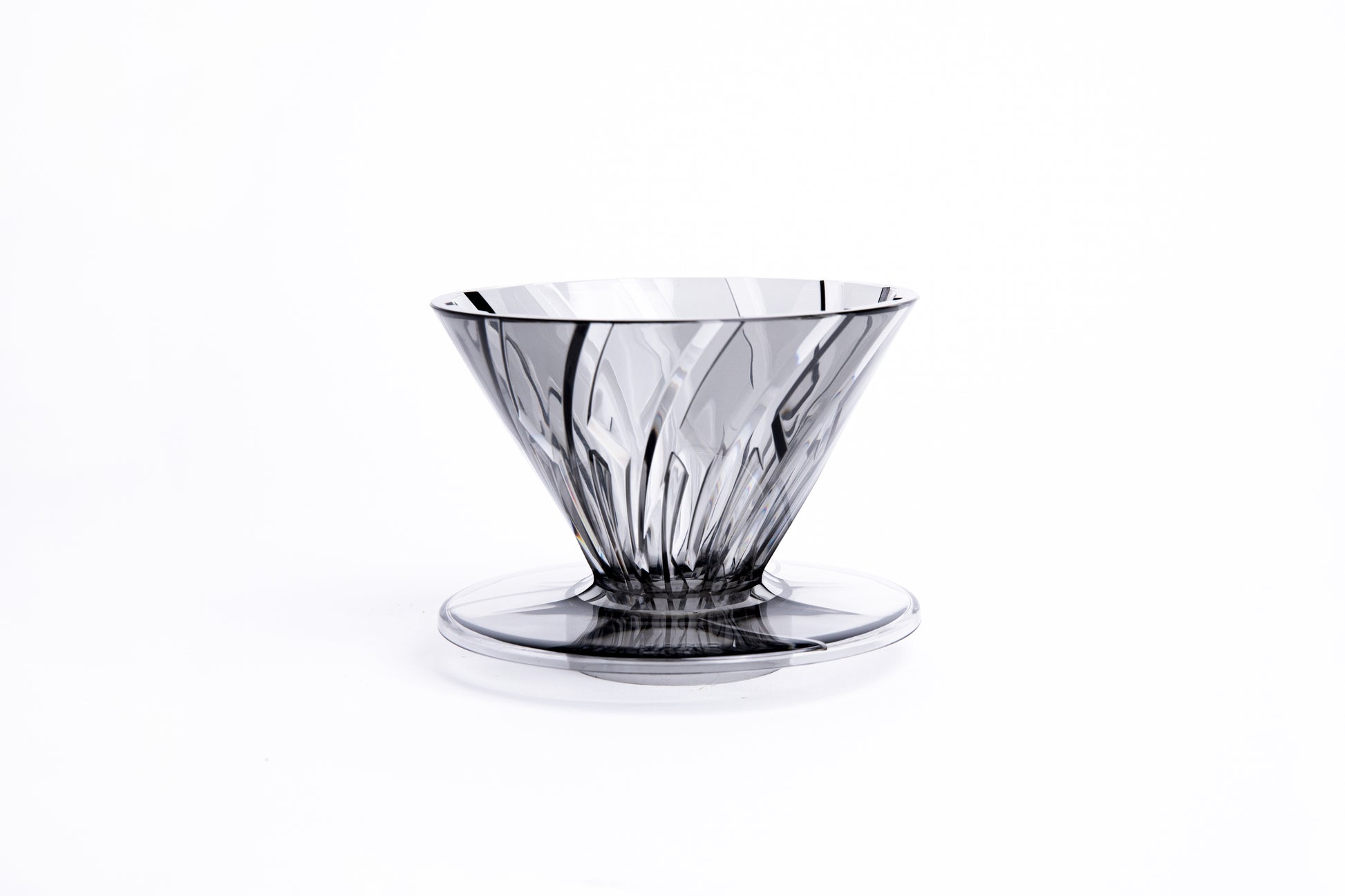 clear gray plastic cone dripper on white background.