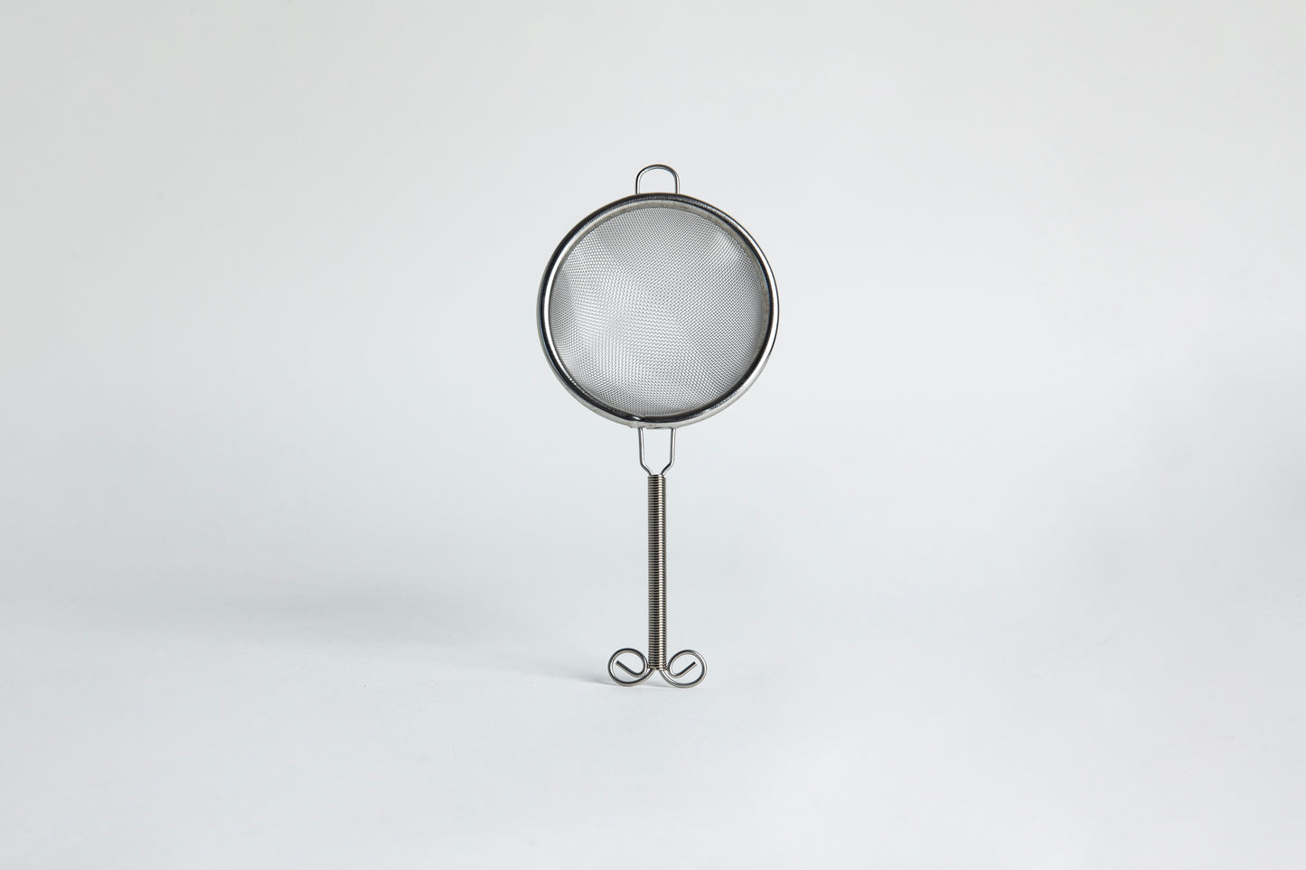 Metal sieve set on a white background