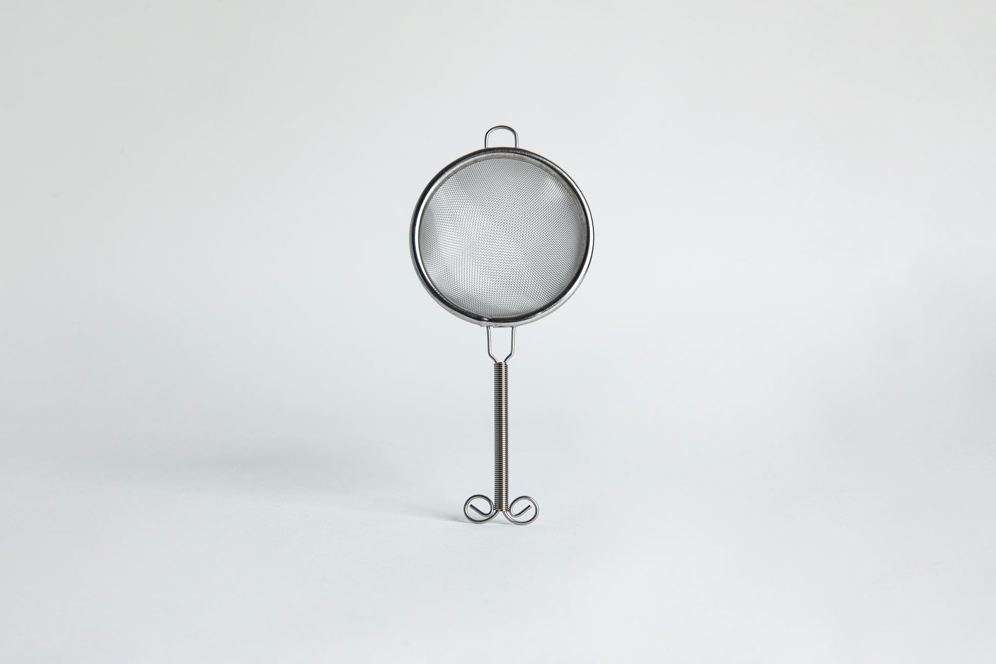 Metal sieve set on a white background