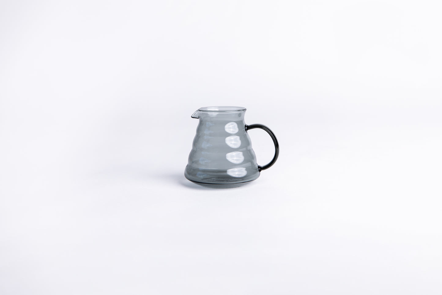 clear gray beehive pitcher on white background