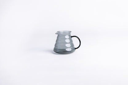 clear gray beehive pitcher on white background