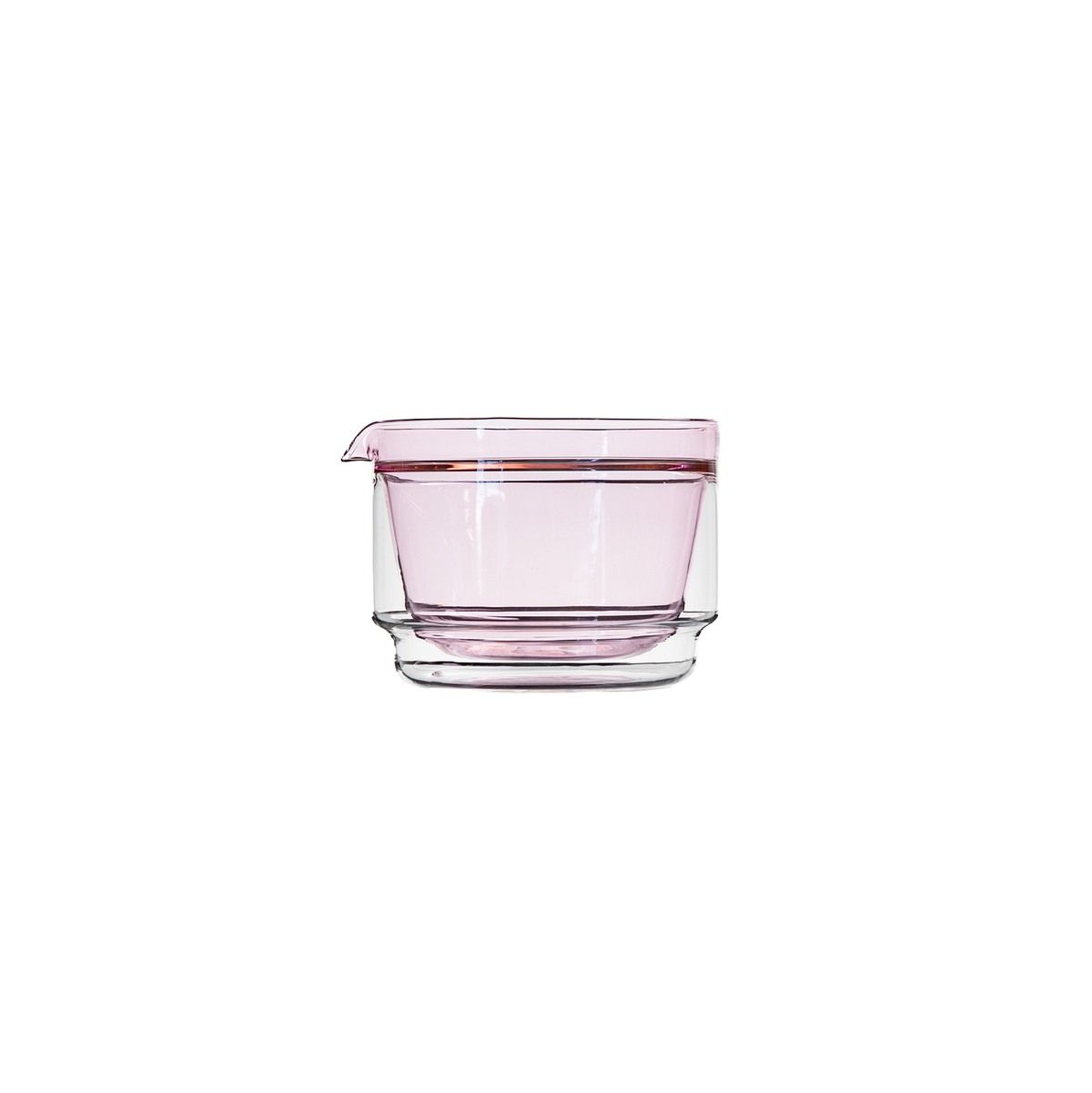 A pink translucent double-walled glass bowl with a small pouring spout, shown on a plain white background.
