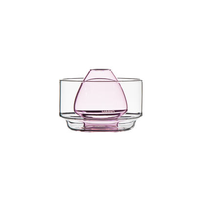 clear glass chasen stand bowl for resting a bamboo matcha whisk and soaking its bristles to soften them, featuring a raised center and pink rounded glass design. on a white background