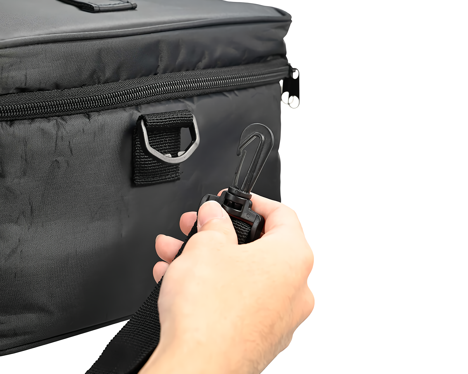 Side view of black bag demonstrating the black strap can be unclipped.