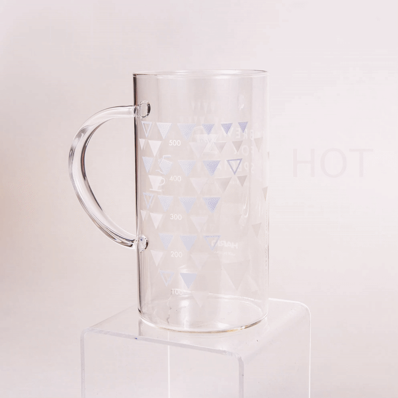 GIF showing the glass server filled with hot and cold coffee to display the changing thermocolor graphics based on the temperature of the drink inside.