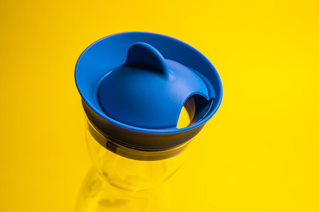 Blue silicone cap with a dome opening and fin knob.