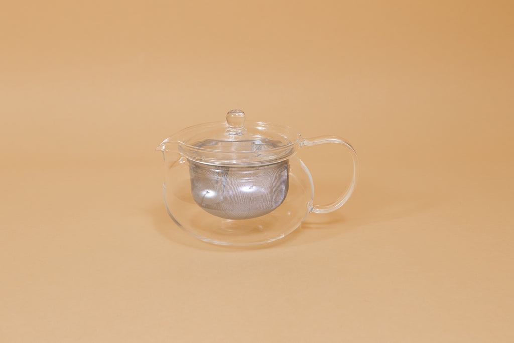 All glass round tea pot with flared top, all glass lid and handle, Metal mesh filter basket insert.