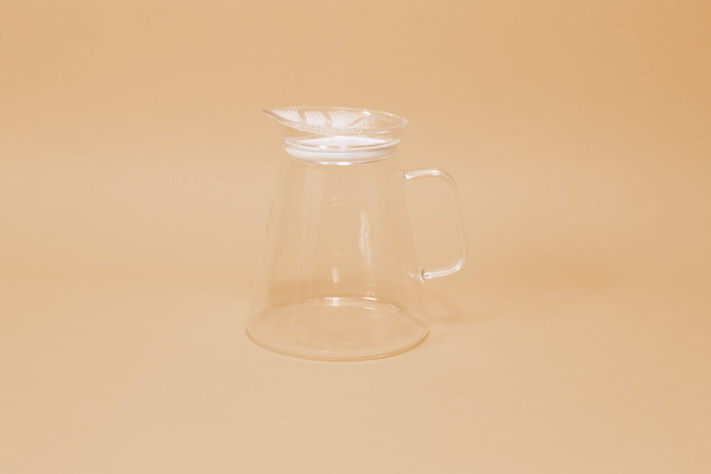 Clear all glass server with handle and clear plastic lid with perforations and white gasket