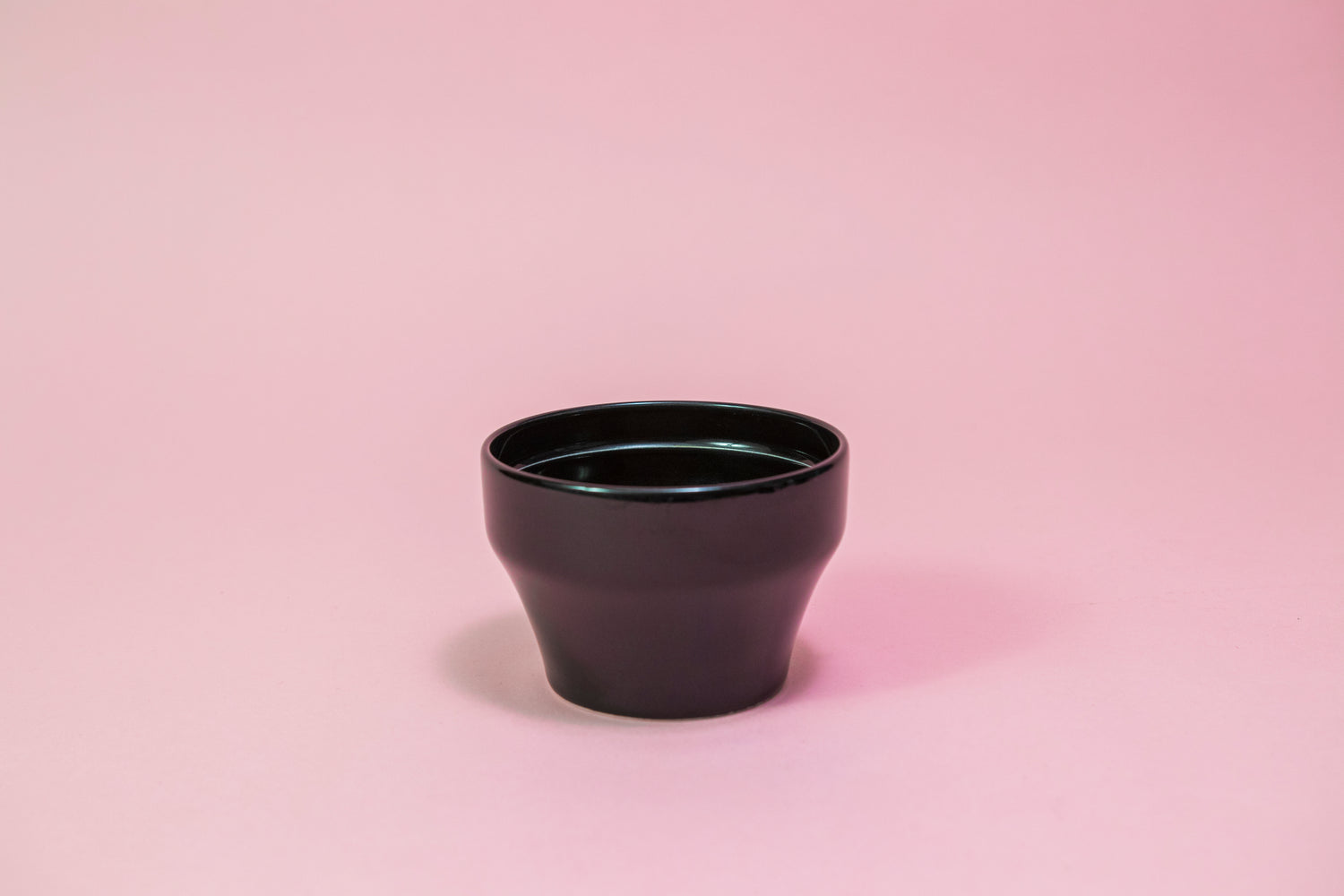 All black ceramic tapered cupping bowl with inner ridge.