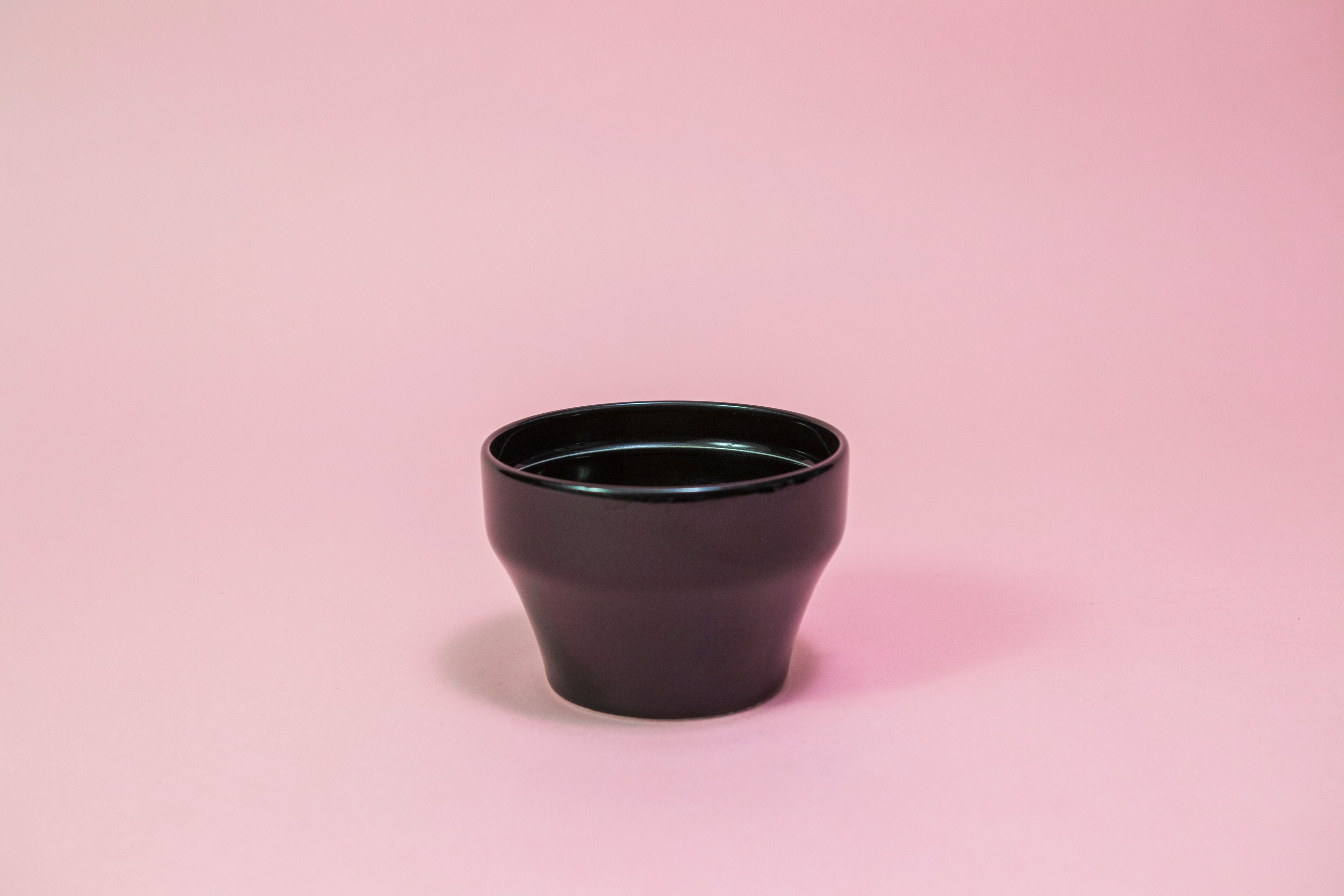 All black ceramic tapered cupping bowl with inner ridge.