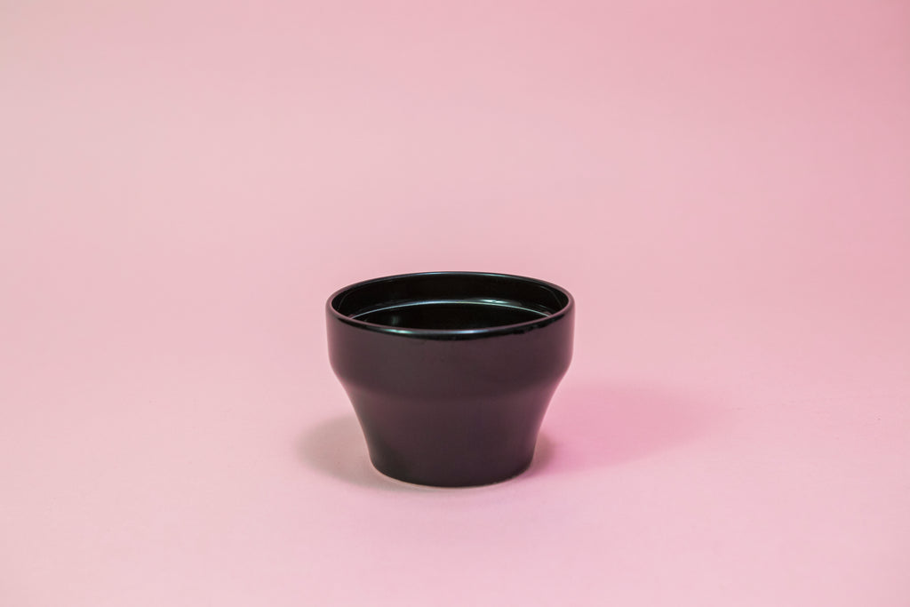 All black ceramic tapered cupping bowl with inner ridge.