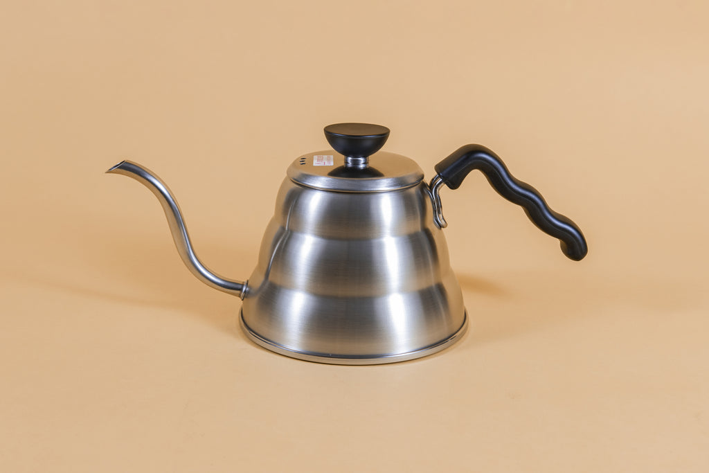 Short stainless steel gooseneck kettle and matching lid with plastic knob and black plastic covered handle.