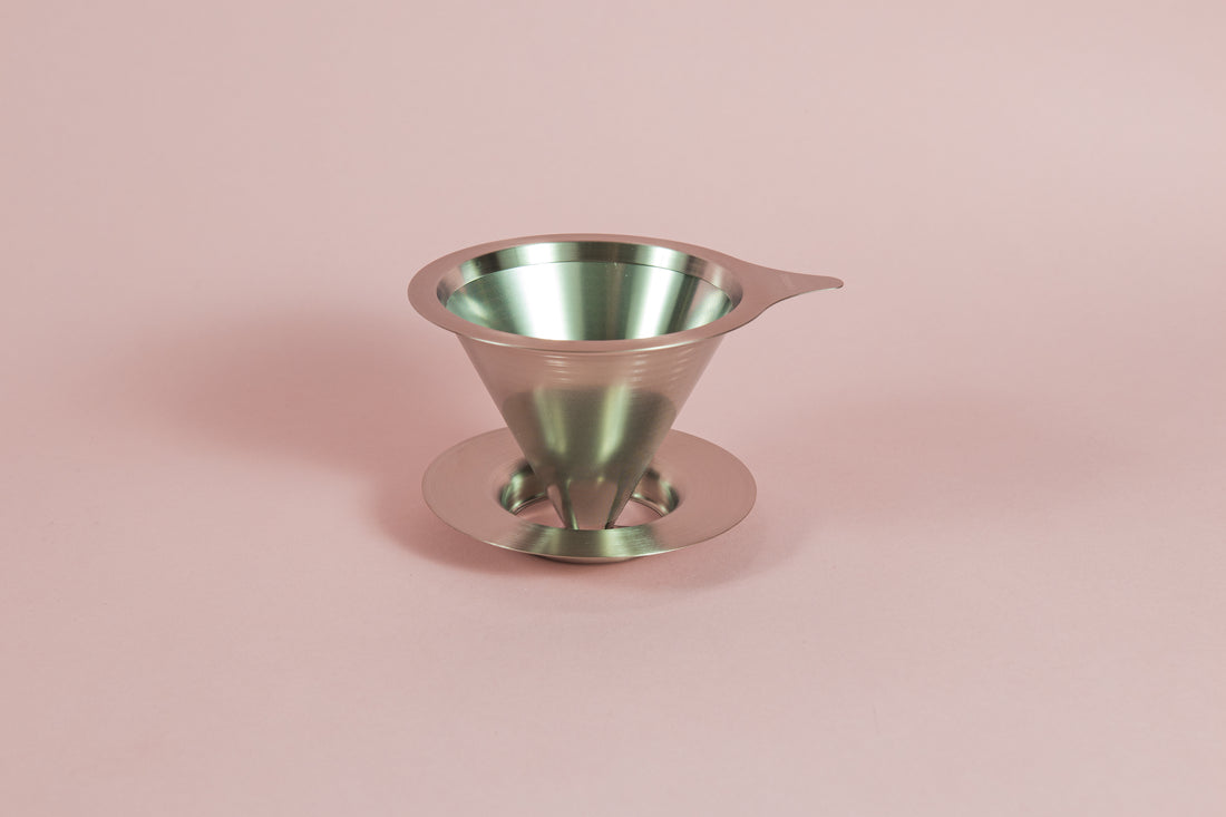 Cone shaped double metal mesh coffee filter with tab and round base.