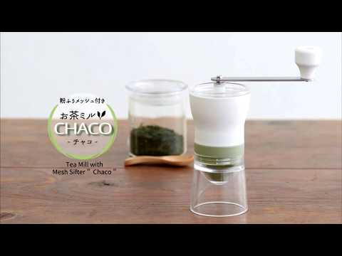 Video showing the dissembling and reassembling of the loose leaf tea grinder with clear plastic base, mesh tea leaf sifter, white powder coated hopper, and handle with white powder coated knob.